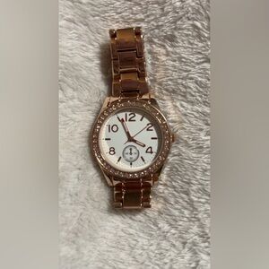 Claire's watch with a rose gold-tone bracelet and a crystal-accented bezel